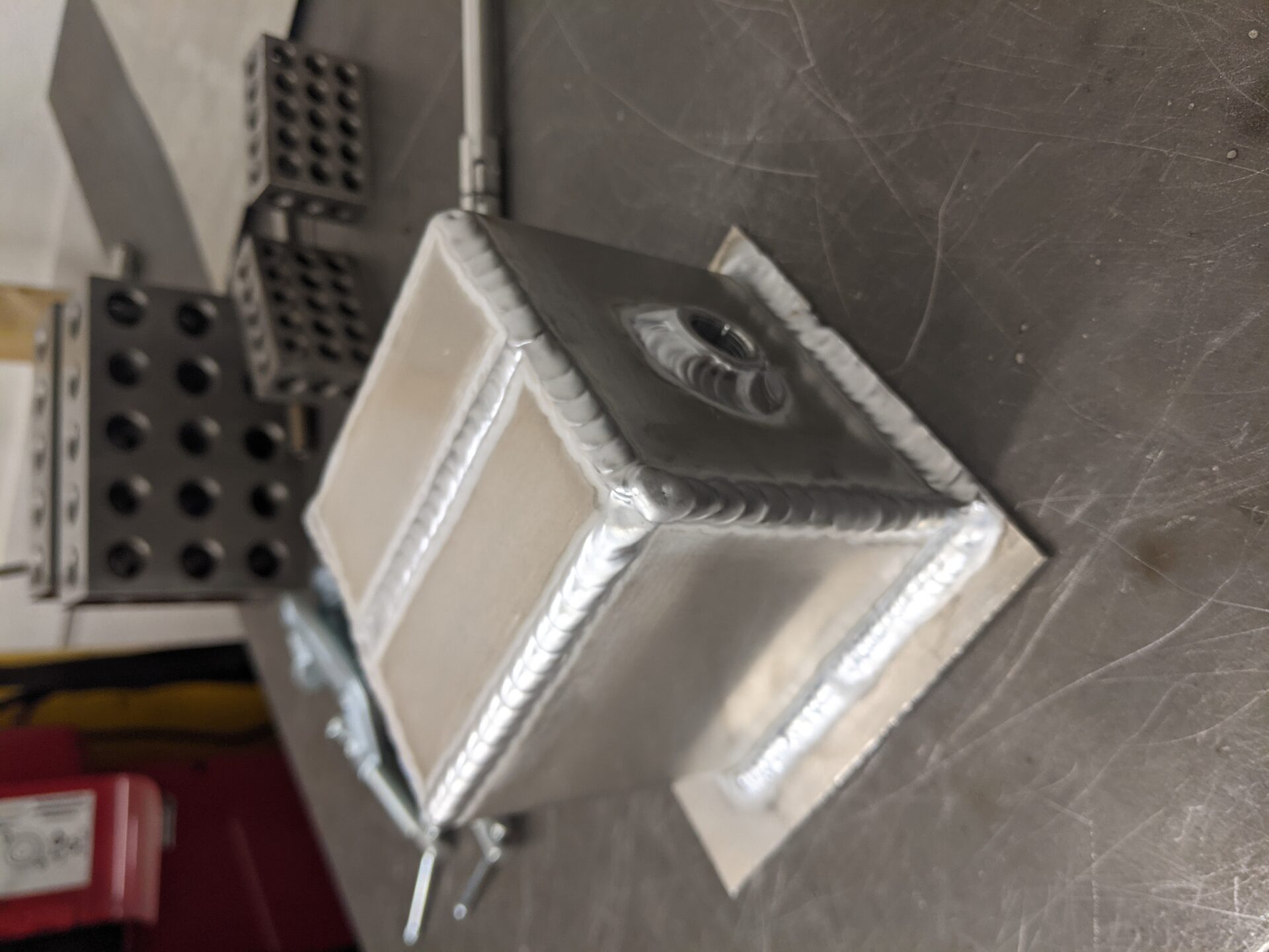 Pressure testing a welded fabrication